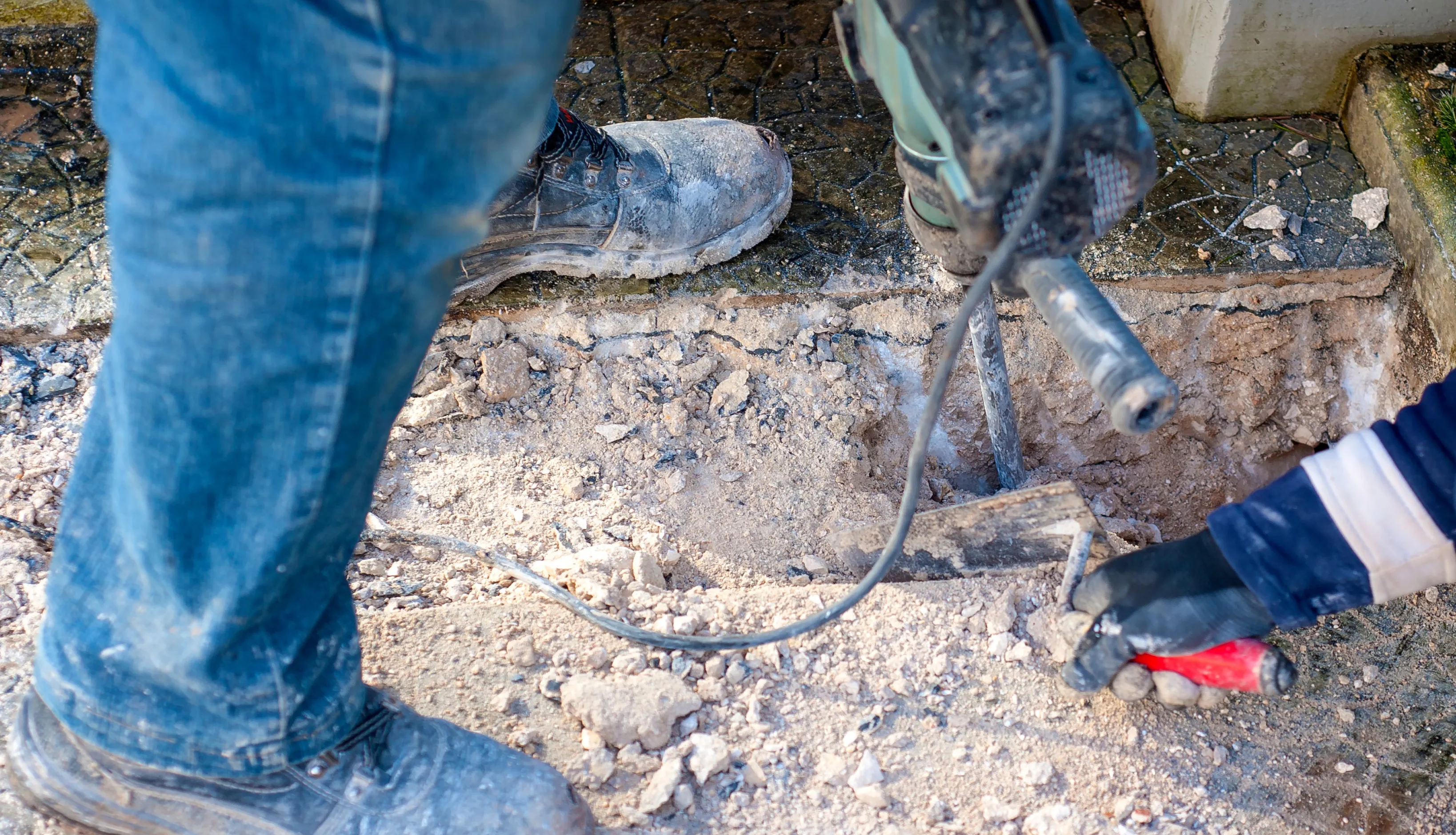 Close-up of pool steps undergoing demolition in Los Angeles, preparing the structure for a full reconstruction and new layout changes.