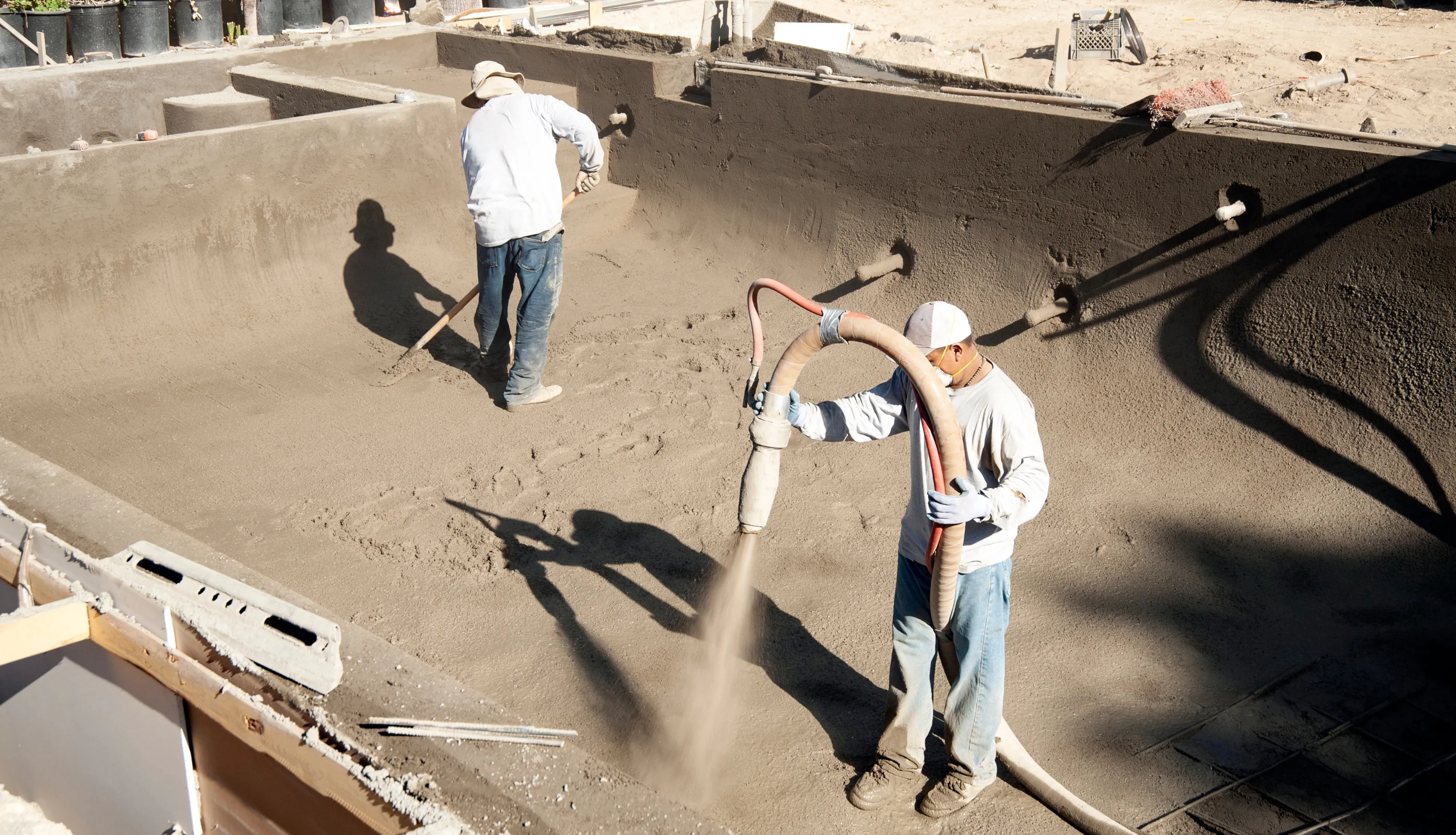 Structural gunite and block phase of a new residential pool installation following Los Angeles building safety codes.